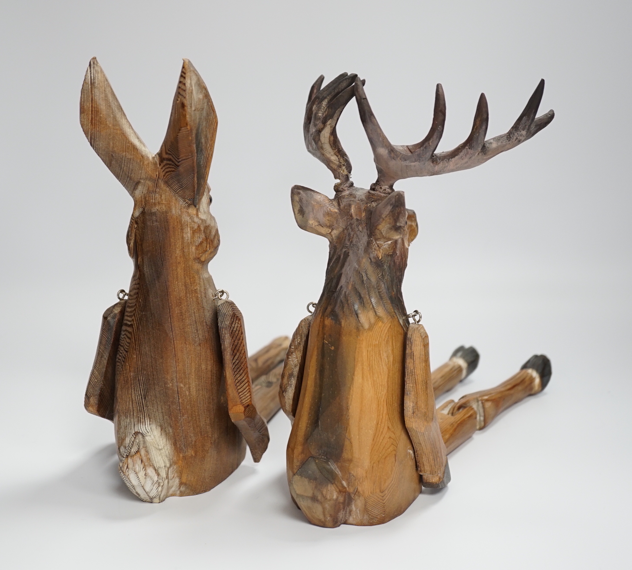 A of novelty jointed carved wooden Deer and similar Hare - 43cm